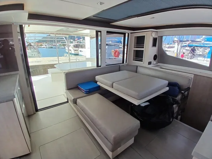 Sail La Vie Yacht Photos Pics Interior of 2019 Leopard 45 catamaran with modern seating and marina view.