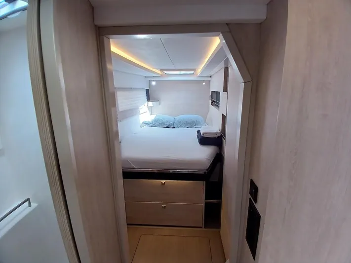 Sail La Vie Yacht Photos Pics Cozy bedroom in 2019 Leopard 45 yacht with modern lighting and storage.