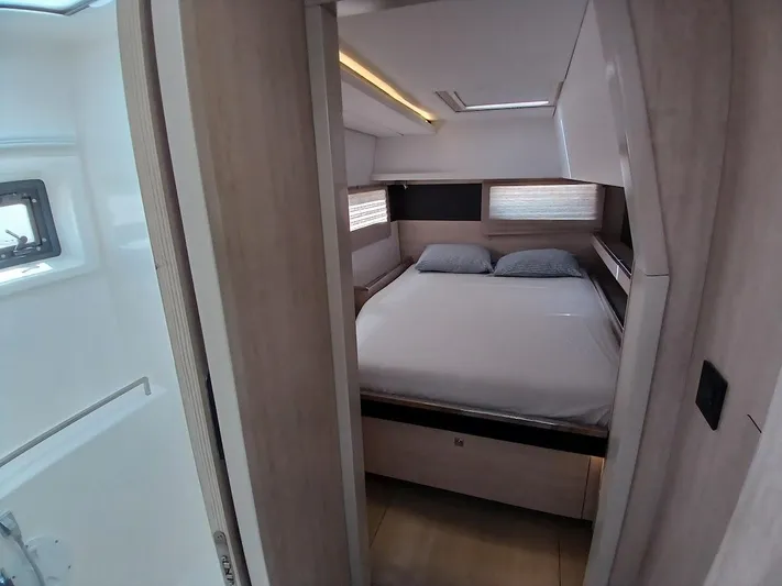 Sail La Vie Yacht Photos Pics Interior cabin of 2019 Leopard 45 yacht with cozy bed and modern design.