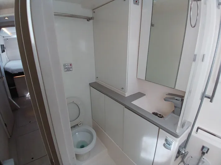 Sail La Vie Yacht Photos Pics Modern bathroom in a 2019 Leopard 45 yacht, featuring sleek cabinetry and fixtures.