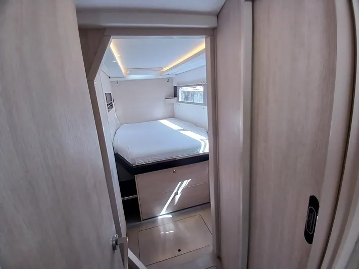 Sail La Vie Yacht Photos Pics Cozy bedroom in 2019 Leopard 45 yacht with modern design and natural lighting.