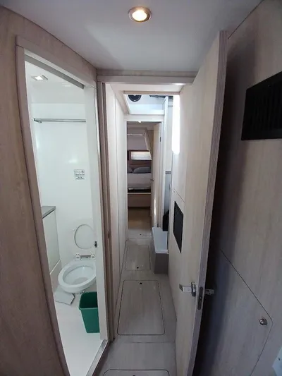 Sail La Vie Yacht Photos Pics Interior hallway of 2019 Leopard 45 yacht with bathroom and bedroom view.