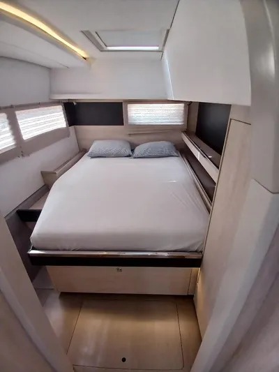 Sail La Vie Yacht Photos Pics Luxurious cabin interior of 2019 Leopard 45 catamaran with cozy bed and modern design.