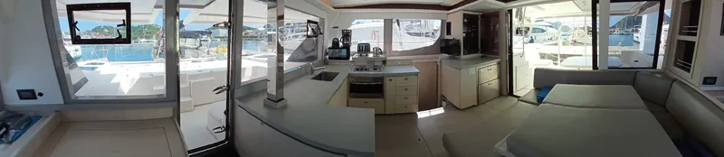 Sail La Vie Yacht Photos Pics Interior of 2019 Leopard 45 catamaran, featuring modern kitchen and spacious seating area.