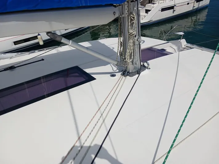 Sail La Vie Yacht Photos Pics 2019 Leopard 45 catamaran deck with rigging and blue sail cover.