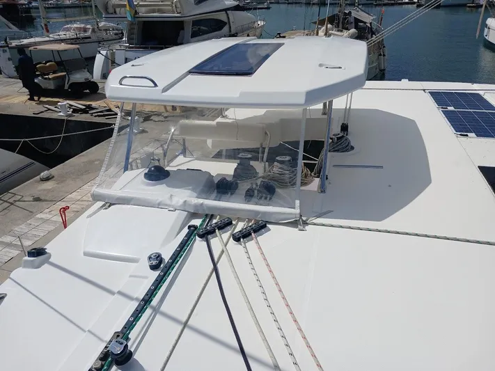 Sail La Vie Yacht Photos Pics 2019 Leopard 45 catamaran deck with ropes and solar panels in marina.