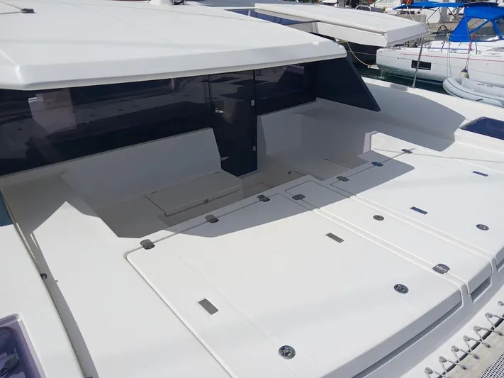 Sail La Vie Yacht Photos Pics 2019 Leopard 45 yacht deck with seating area and storage compartments.