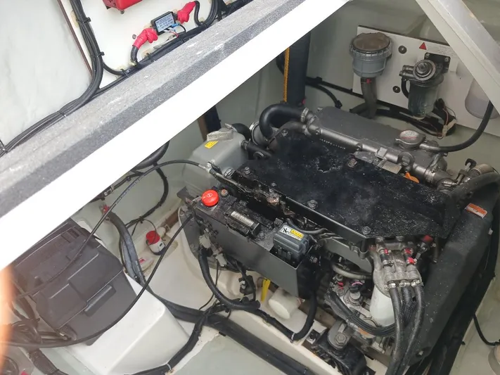 Sail La Vie Yacht Photos Pics Engine compartment of a 2019 Leopard 45 catamaran, showcasing mechanical components and wiring.