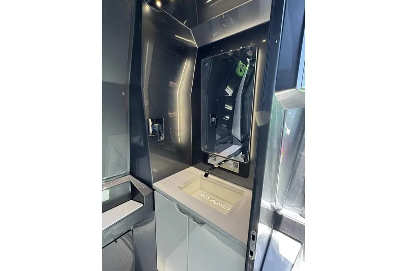  Yacht Photos Pics Modern bathroom interior in 2023 Adrenaline 47, featuring sleek design and mirror.