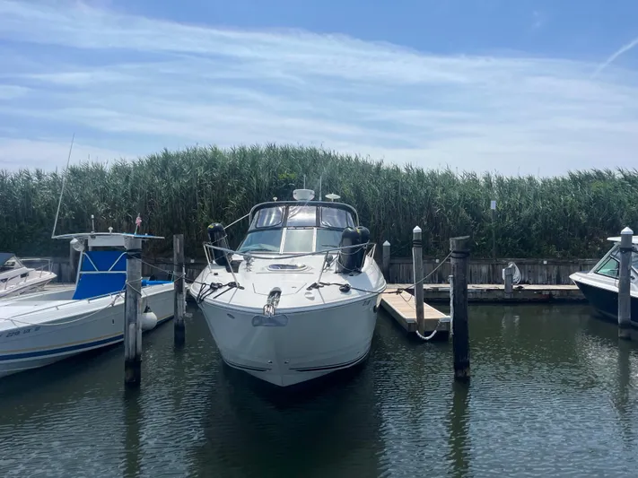 Sweet Emily II Yacht Photos Pics 2015 Sea Ray 350 Sundancer docked in a marina under a clear blue sky.