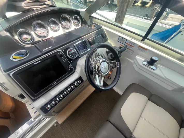 Sweet Emily II Yacht Photos Pics 2015 Sea Ray 350 Sundancer helm with modern controls and navigation displays.