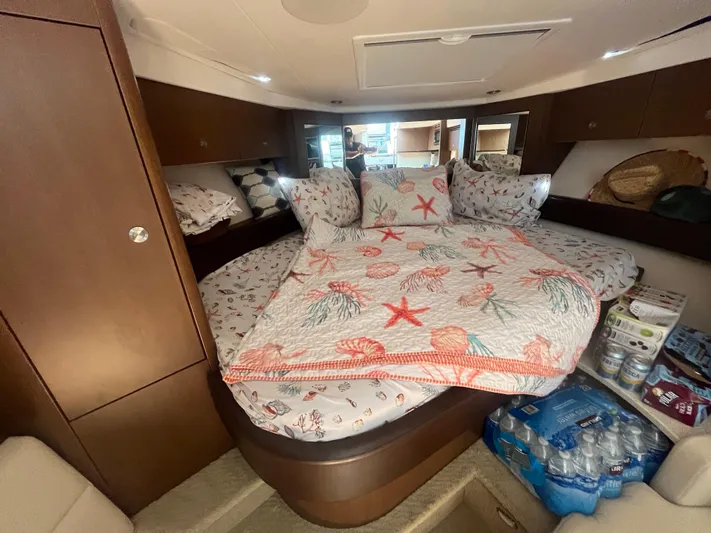 Sweet Emily II Yacht Photos Pics Interior cabin of 2015 Sea Ray 350 Sundancer with cozy bedding and storage.