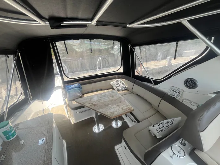 Sweet Emily II Yacht Photos Pics 2015 Sea Ray 350 Sundancer interior with seating and table, featuring modern design and comfort.
