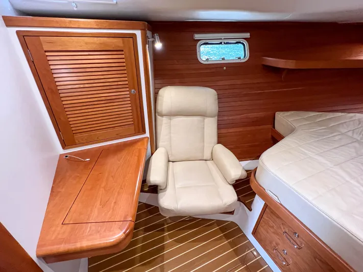 Highlander Yacht Photos Pics Luxurious cabin interior of 2017 MJM 50z yacht with wooden desk and plush chair.