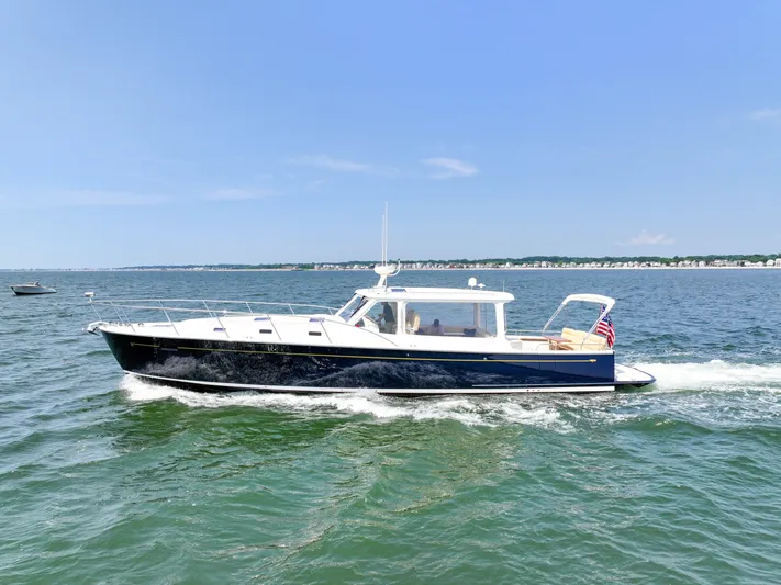 Highlander Yacht Photos Pics 2017 MJM 50z yacht cruising on open water under clear blue skies.