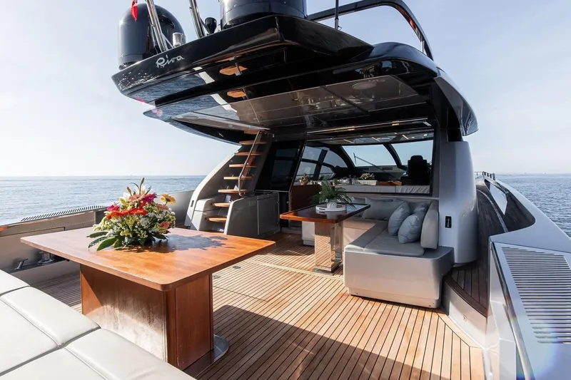  Yacht Photos Pics Luxurious 2016 Riva 76' Perseo yacht deck with elegant seating and ocean view.