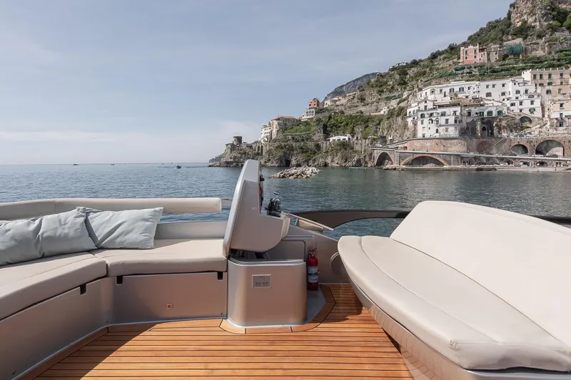  Yacht Photos Pics Luxurious 2016 Riva 76' Perseo yacht with scenic coastal view and elegant seating.