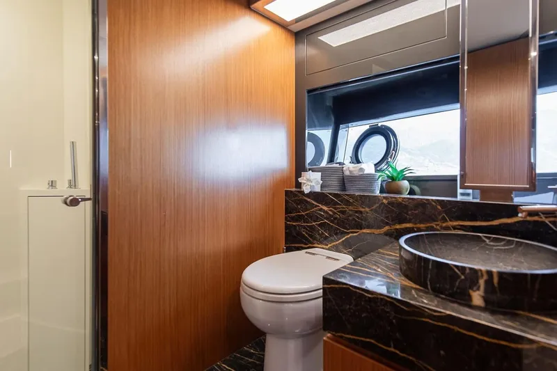  Yacht Photos Pics Luxurious bathroom on 2016 Riva 76' Perseo yacht with elegant wood and marble finishes.