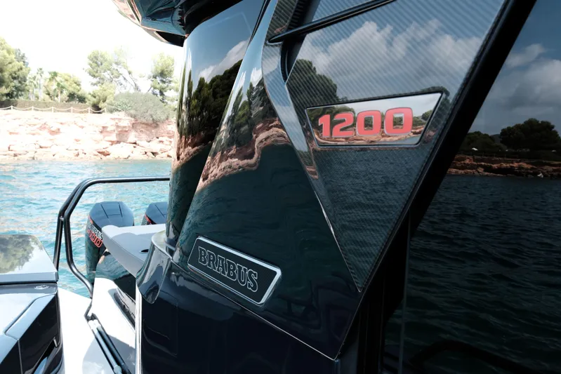 Ex Felgenhauer Yacht Photos Pics 2023 BRABUS Shadow 1200 Cross Cabin on water, showcasing sleek design and branding.