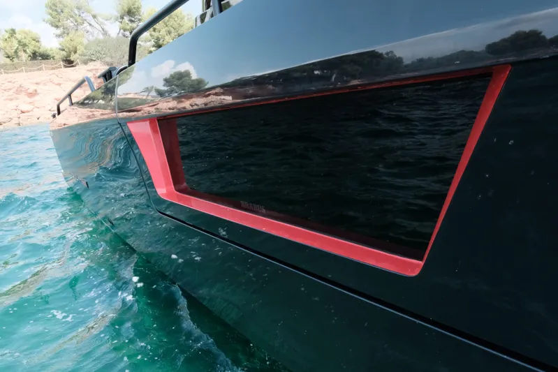 Ex Felgenhauer Yacht Photos Pics 2023 BRABUS Shadow 1200 Cross Cabin yacht on turquoise water, sleek design detail.