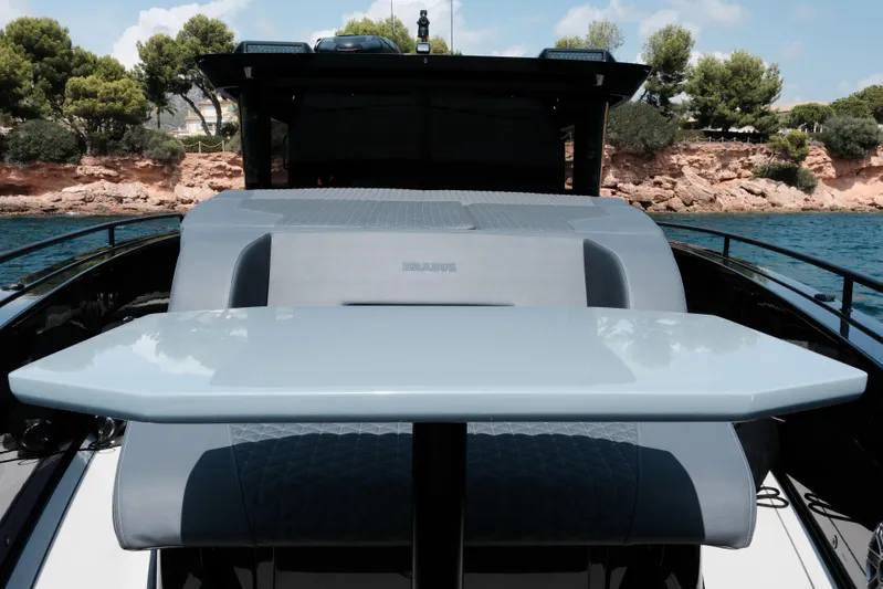 Ex Felgenhauer Yacht Photos Pics BRABUS Shadow 1200 Cross Cabin 2023, sleek design, luxury seating, coastal backdrop.