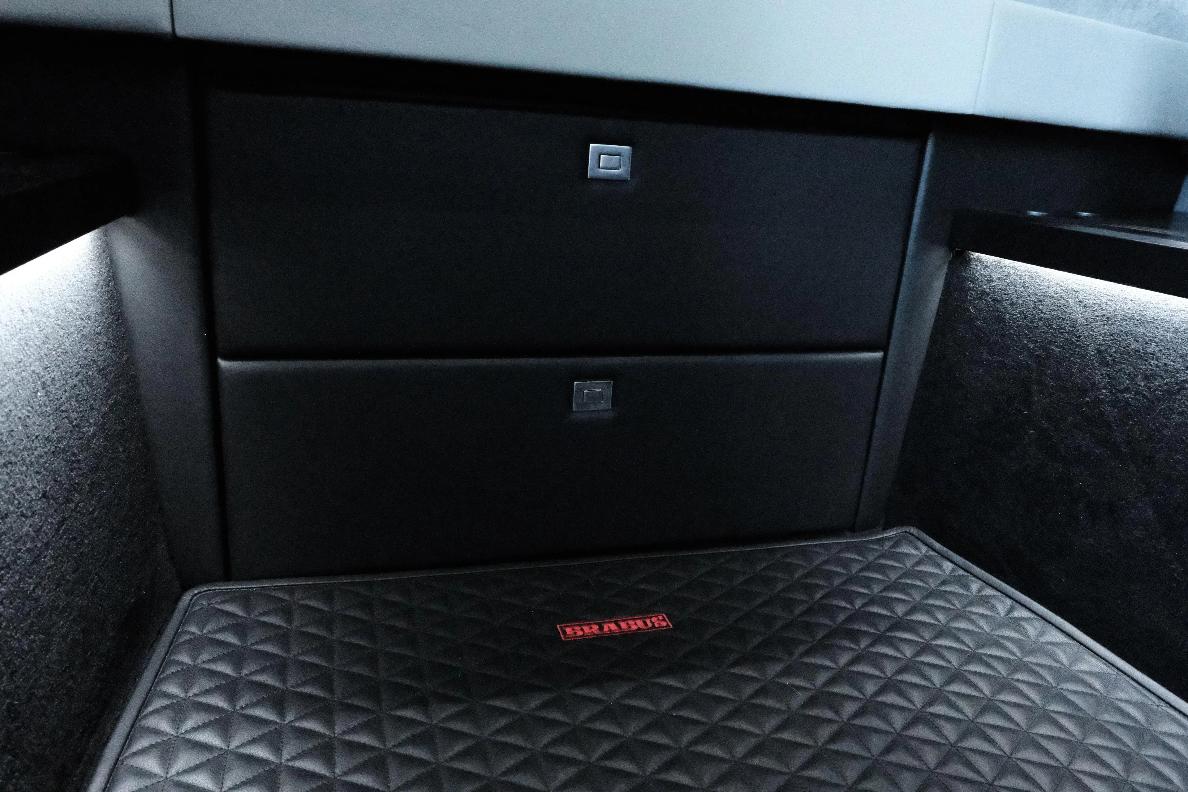 Ex Felgenhauer Yacht Photos Pics 2023 BRABUS Shadow 1200 Cross Cabin interior with quilted mat and sleek storage drawers.