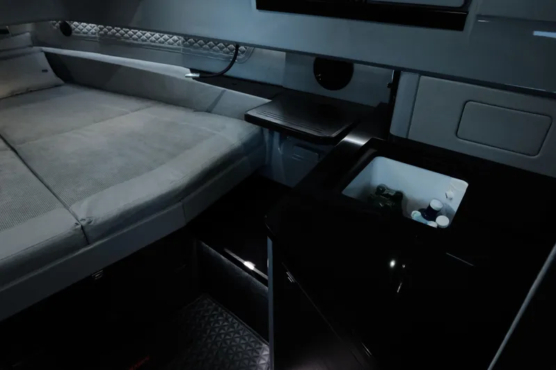 Ex Felgenhauer Yacht Photos Pics Luxurious interior of 2023 BRABUS Shadow 1200 Cross Cabin with bed and mini fridge.
