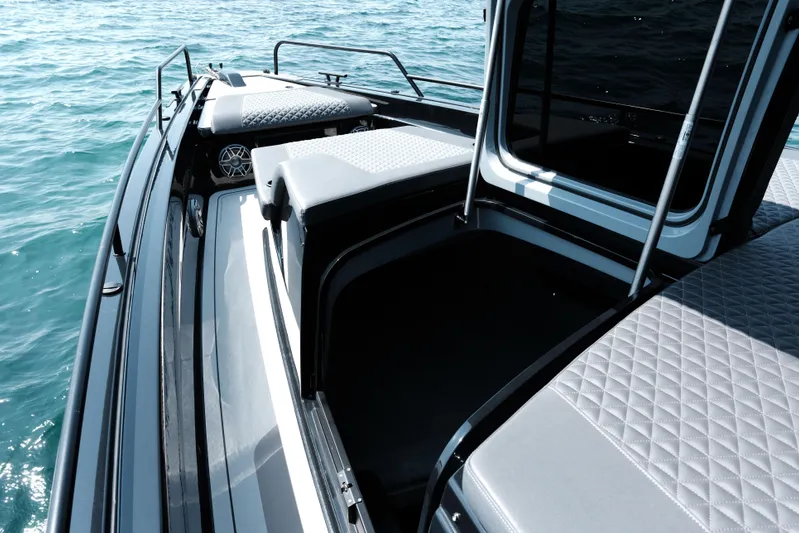 Ex Felgenhauer Yacht Photos Pics 2023 BRABUS Shadow 1200 Cross Cabin boat interior with quilted seating on open water.