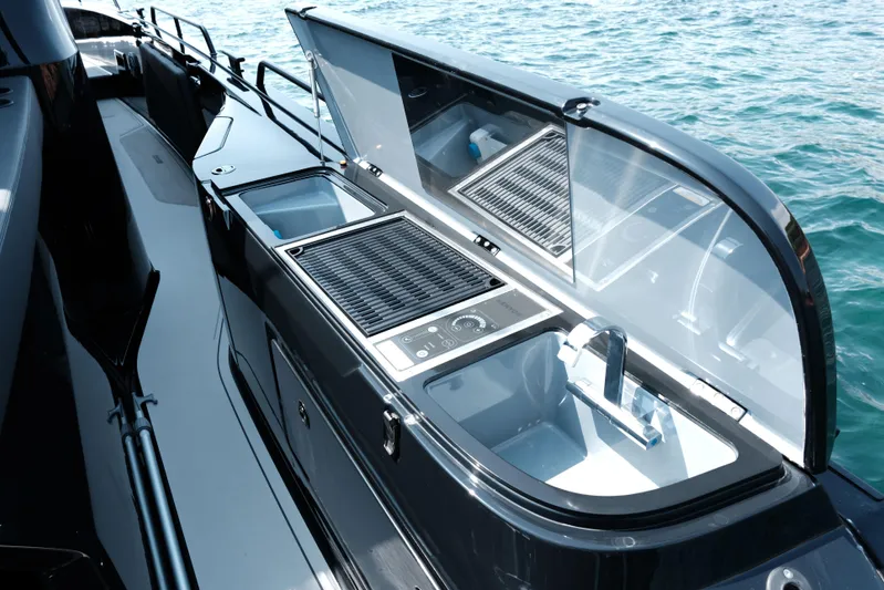 Ex Felgenhauer Yacht Photos Pics 2023 BRABUS Shadow 1200 Cross Cabin yacht with sleek outdoor kitchen setup.