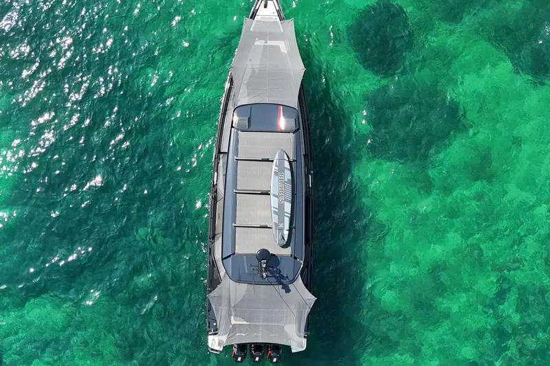 Ex Felgenhauer Yacht Photos Pics Aerial view of 2023 BRABUS Shadow 1200 Cross Cabin on turquoise water.