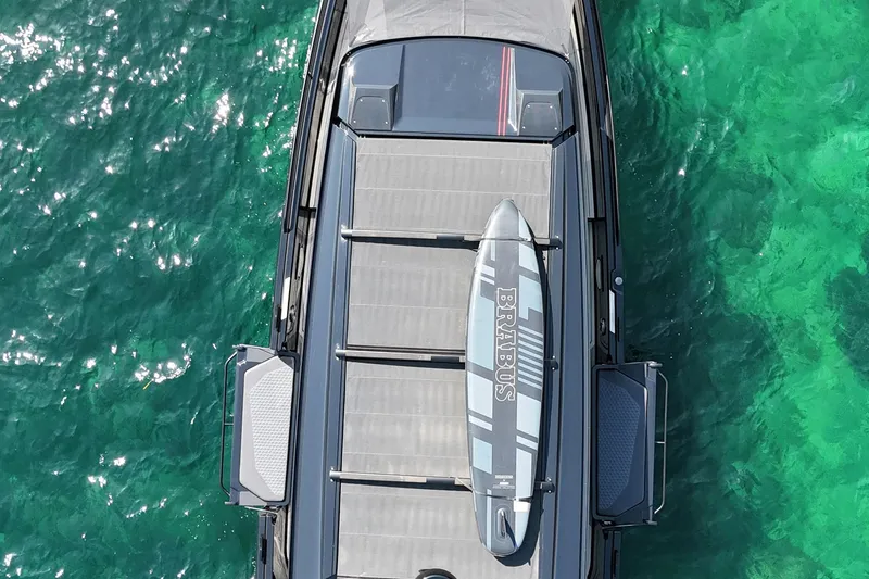 Ex Felgenhauer Yacht Photos Pics Aerial view of 2023 BRABUS Shadow 1200 Cross Cabin on turquoise water.