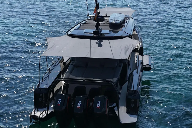 Ex Felgenhauer Yacht Photos Pics 2023 BRABUS Shadow 1200 Cross Cabin boat on water, rear view with engines visible.