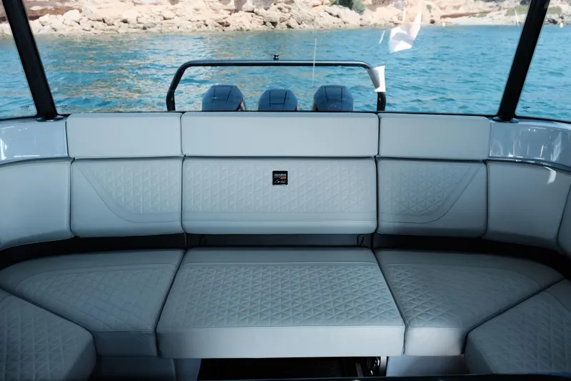 Ex Felgenhauer Yacht Photos Pics Luxurious interior of 2023 BRABUS Shadow 1200 Cross Cabin boat with quilted seating.