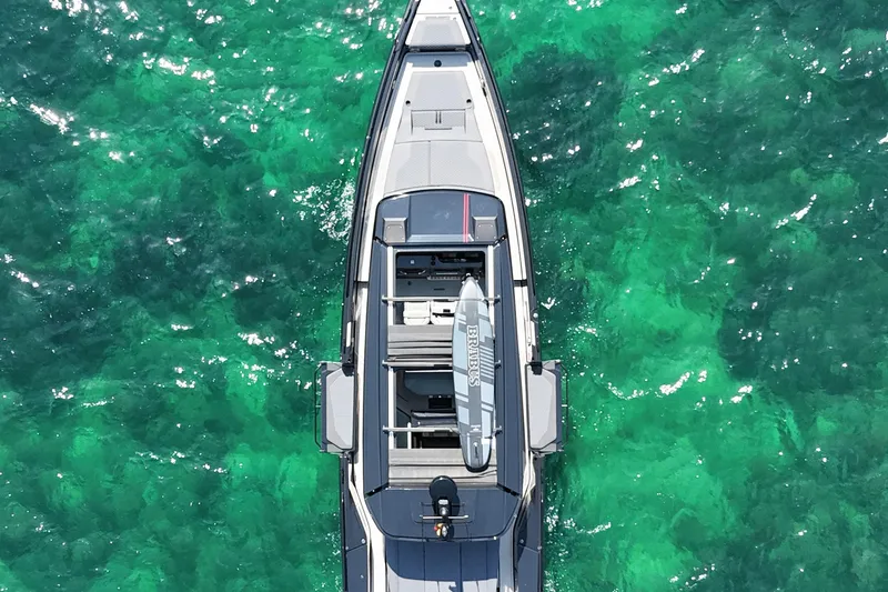 Ex Felgenhauer Yacht Photos Pics Aerial view of 2023 BRABUS Shadow 1200 Cross Cabin on turquoise water.