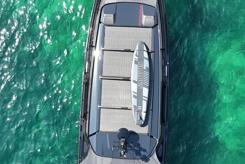 Ex Felgenhauer Yacht Photos Pics Aerial view of 2023 BRABUS Shadow 1200 Cross Cabin on turquoise water.