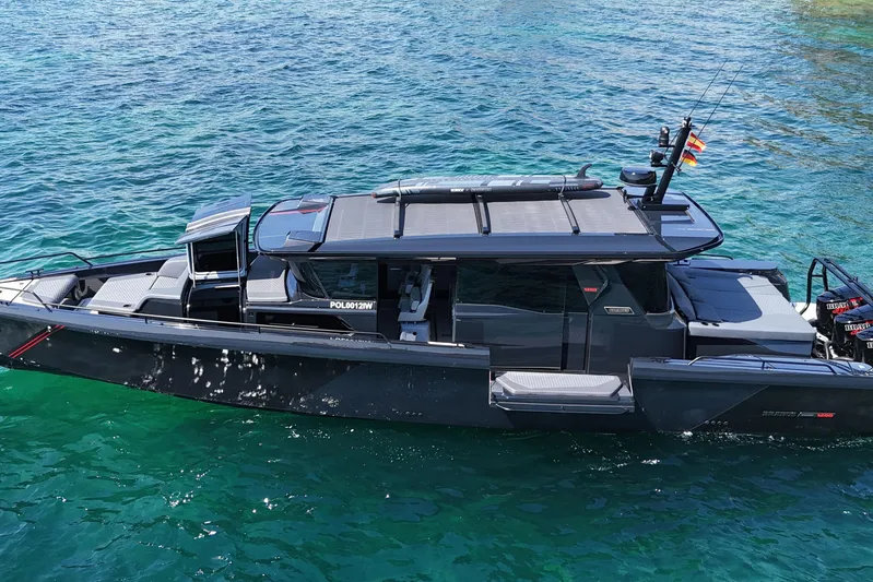 Ex Felgenhauer Yacht Photos Pics 2023 BRABUS Shadow 1200 Cross Cabin boat on clear blue water.