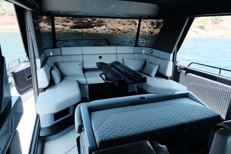 Ex Felgenhauer Yacht Photos Pics Luxurious interior of 2023 BRABUS Shadow 1200 Cross Cabin yacht with elegant seating.