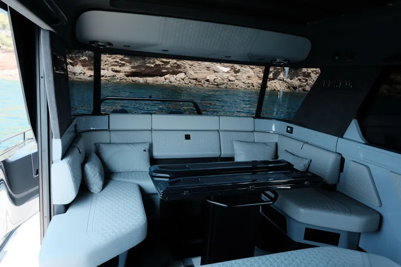 Ex Felgenhauer Yacht Photos Pics Luxurious interior of 2023 BRABUS Shadow 1200 Cross Cabin yacht with elegant seating.