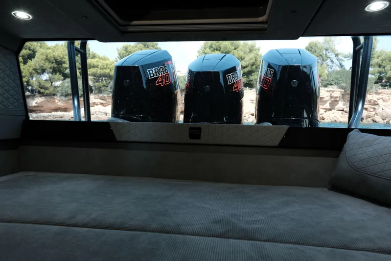 Ex Felgenhauer Yacht Photos Pics Interior view of 2023 BRABUS Shadow 1200 Cross Cabin with triple outboard engines.