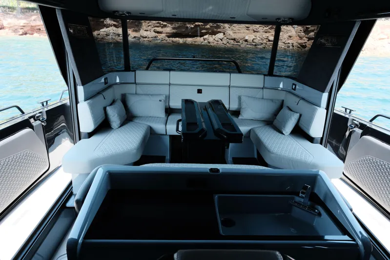 Ex Felgenhauer Yacht Photos Pics Luxurious interior of 2023 BRABUS Shadow 1200 Cross Cabin yacht with elegant seating and modern design.