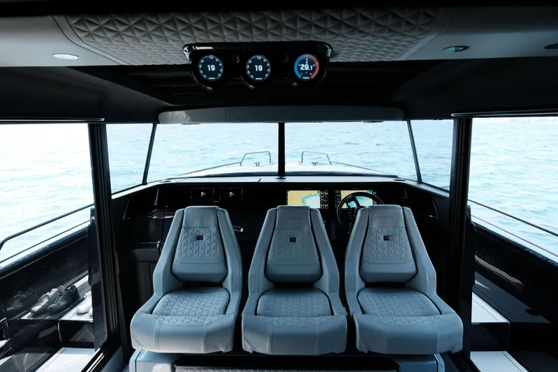 Ex Felgenhauer Yacht Photos Pics Interior of 2023 BRABUS Shadow 1200 Cross Cabin with luxury seating and navigation display.