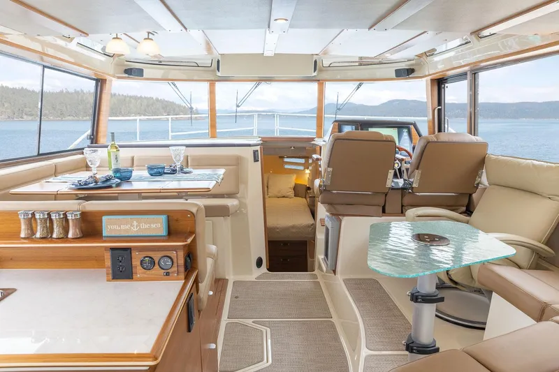  Yacht Photos Pics Luxurious interior of 2025 Ranger Tugs R-43 S yacht with scenic ocean view.