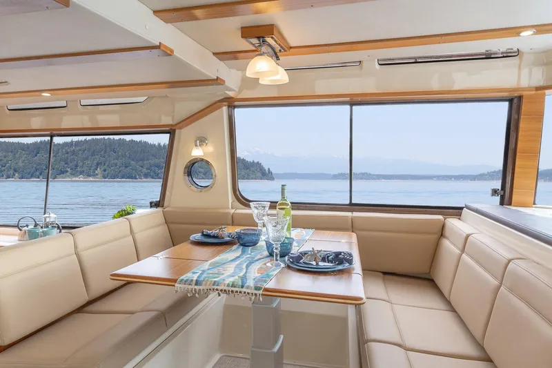  Yacht Photos Pics Luxurious interior of 2025 Ranger Tugs R-43 S yacht with scenic ocean view.