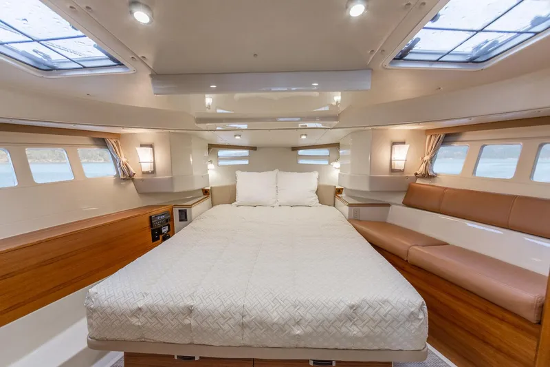  Yacht Photos Pics Luxurious cabin interior of 2025 Ranger Tugs R-43 S with spacious bed and seating.
