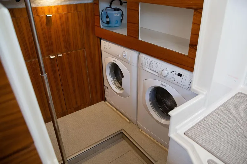  Yacht Photos Pics Laundry area in 2025 Ranger Tugs R-43 S boat with washer and dryer.