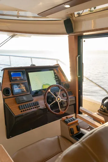  Yacht Photos Pics 2025 Ranger Tugs R-43 S helm with modern navigation technology and luxurious interior.