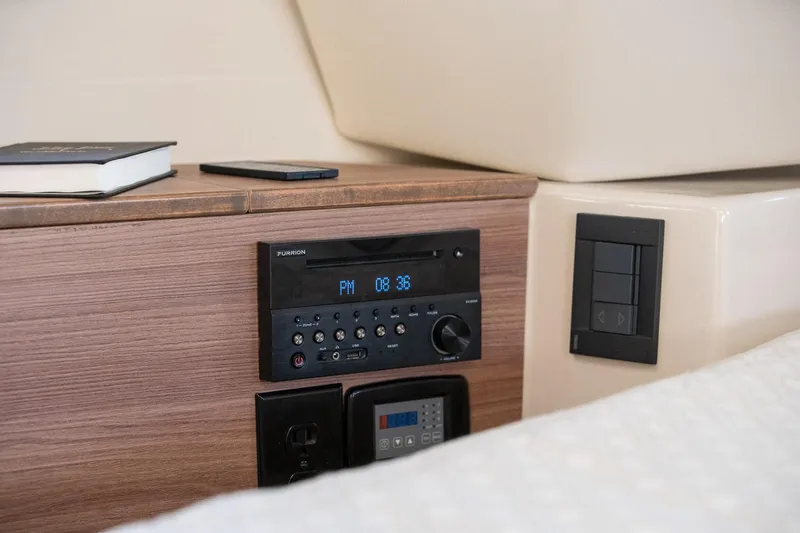  Yacht Photos Pics 2025 Ranger Tugs R-43 S cabin interior with control panel and wooden finish.