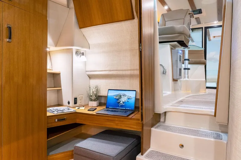  Yacht Photos Pics 2025 Ranger Tugs R-43 S interior with modern workspace and stairs.
