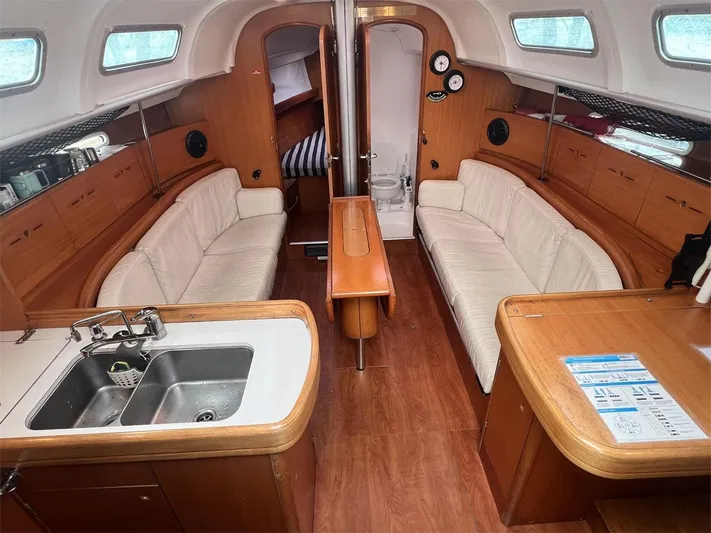 Nirvana Yacht Photos Pics Interior of 2001 Beneteau First 40.7 yacht with cozy seating and kitchenette.