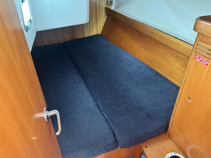 Nirvana Yacht Photos Pics Cozy cabin interior of 2001 Beneteau First 40.7 sailboat with wooden finish.